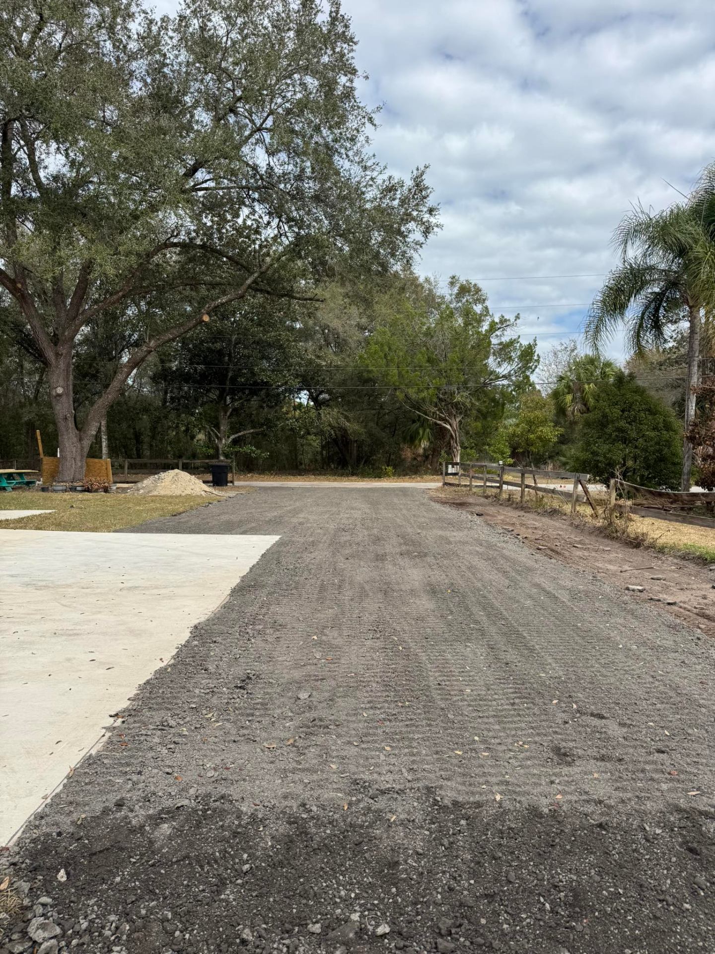 Gravel and millings driveway being graded and shaped in Volusia County, FL